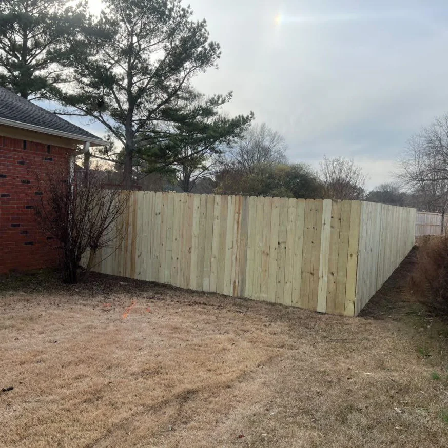 New wooden privacy fence installation